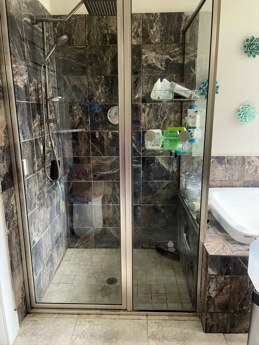 Shower floor after Maids of Cy-Fair clean