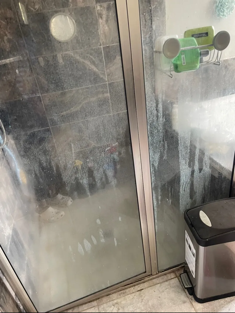 Shower floor before professional cleaning